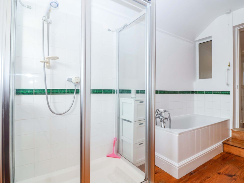 A bathroom with a shower and a bathtub at 12 Heathfield Terrace