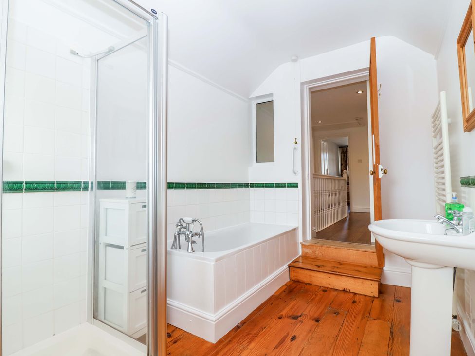 A bathroom with a shower and bathtub at 12 Heathfield Terrace