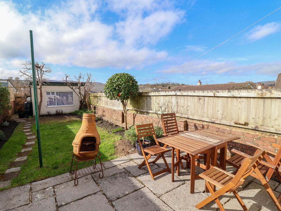 A garden with seating and a shed at 12 Heathfield Terrace