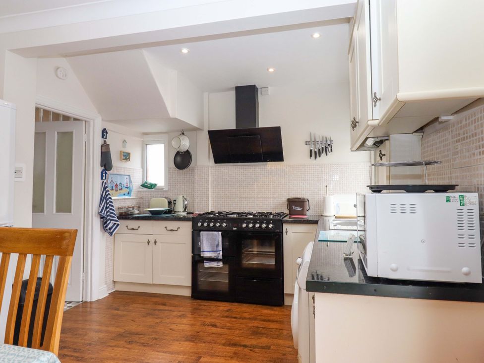 A kitchen with appliances and countertops at 16 Elmbank Gardens in Paignton