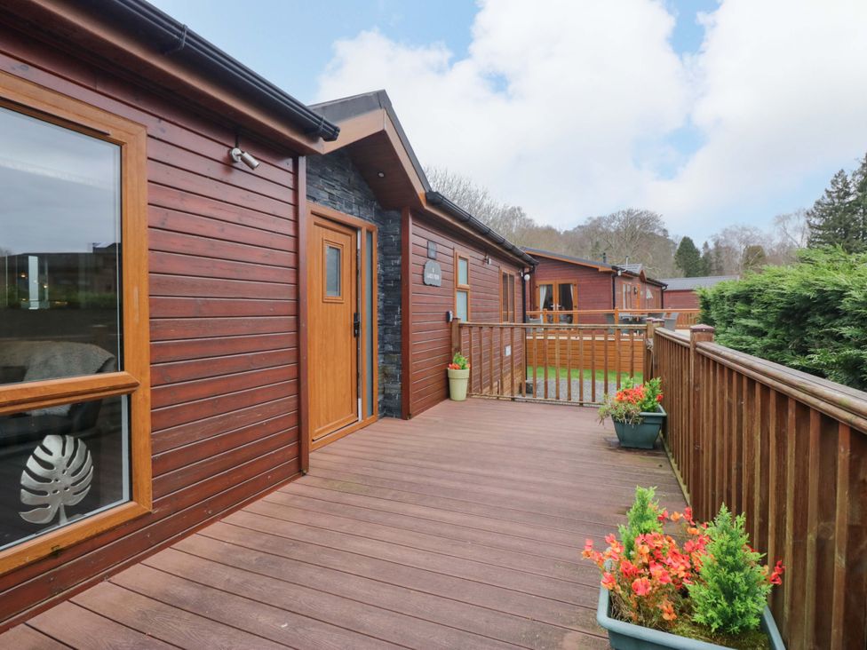 An outdoor deck area with planters at Waters Edge Lodge Windermere