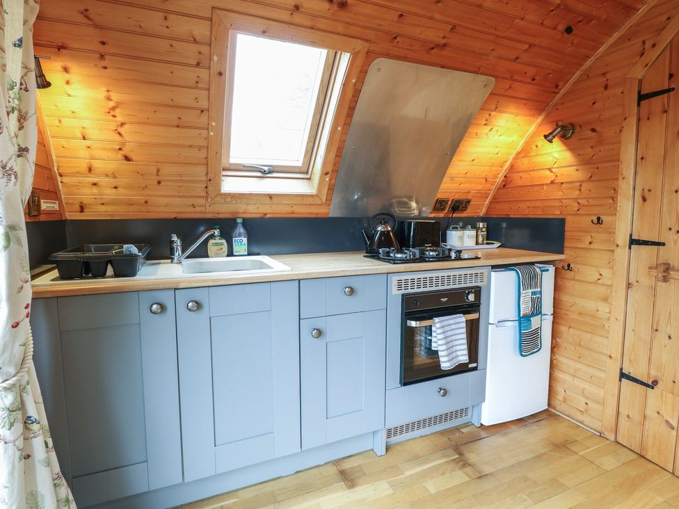 A kitchen with sink and stove at Vine View near Halesworth
