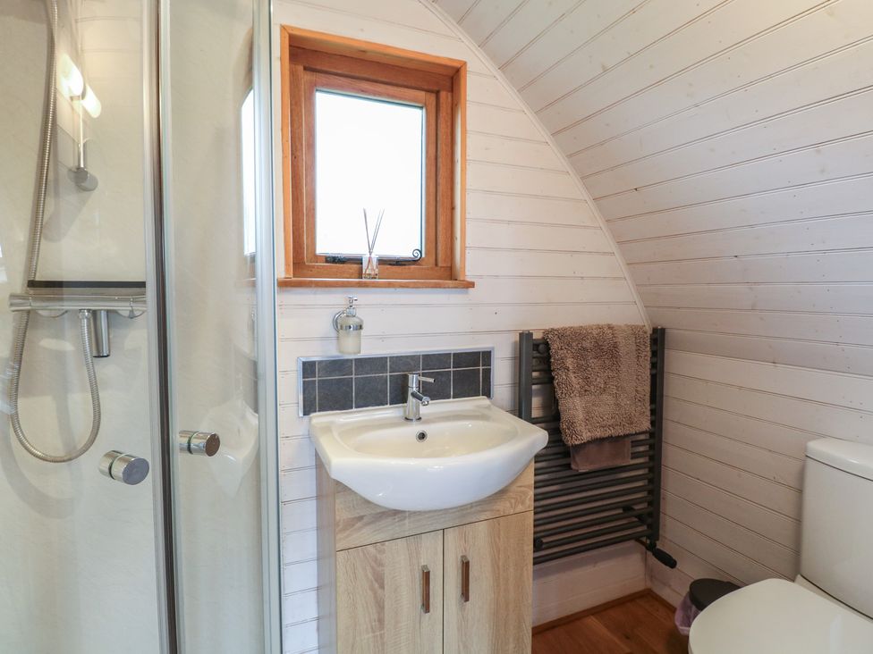 A bathroom with a shower, sink, and toilet at Vine View near Halesworth