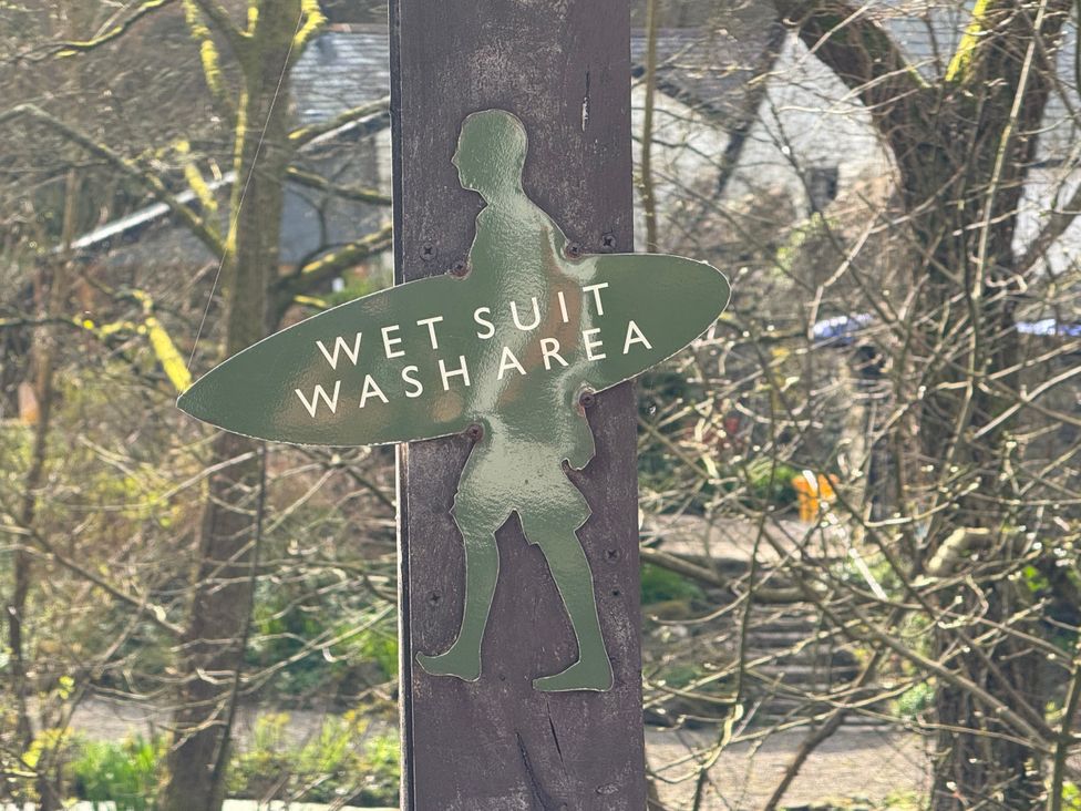 A sign indicating a wet suit wash area at N5 Ilfracombe