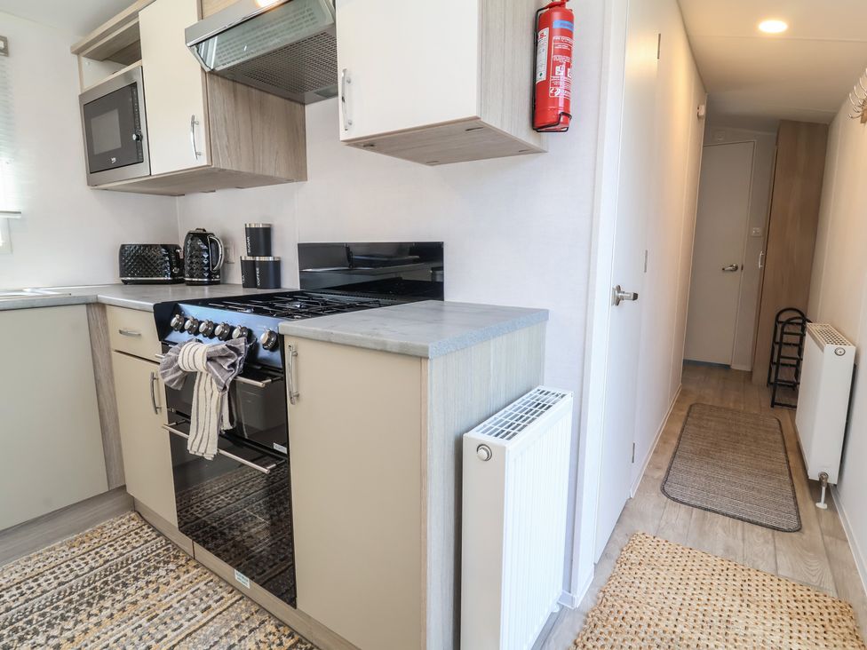 A kitchen with appliances and counter space at N5 Ilfracombe