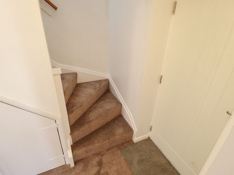 A staircase leading to an upper level at 29B High Street Spilsby