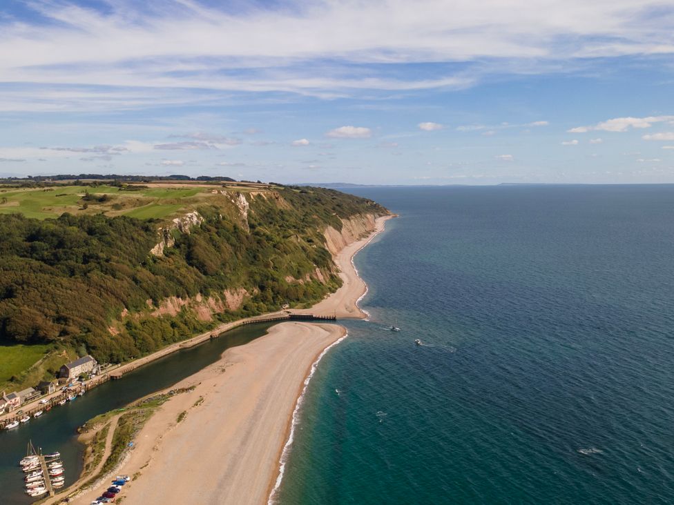 A coastline with beach and boats at Regenna in Seaton