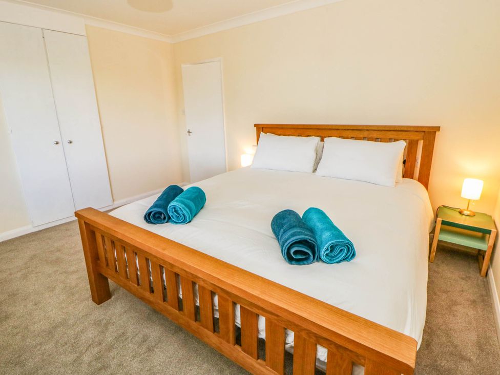 A bedroom with a bed and towels on it at The Croft in Llandrindod Wells
