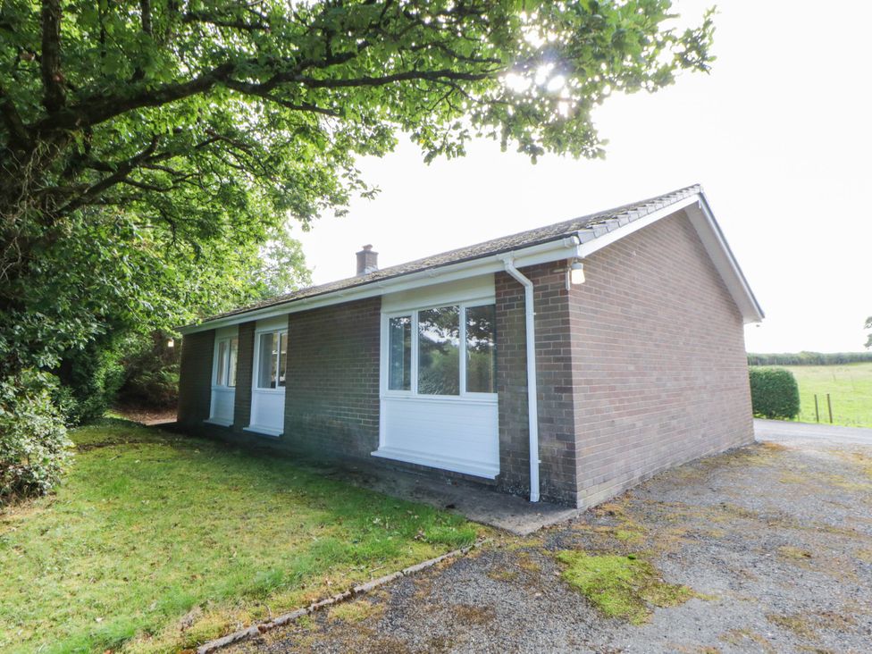 A house with windows and a front yard at The Croft in Llandrindod Wells