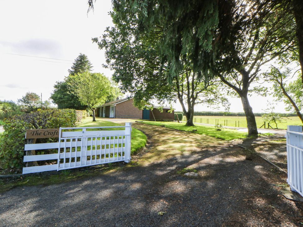 An outdoor view of The Croft with a gate and driveway at The Croft in Llandrindod Wells