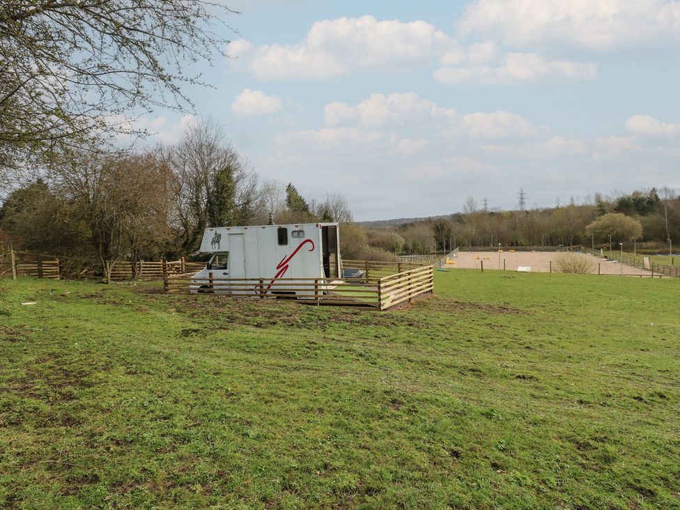 A horsebox in a fenced area on grass at The Horse Box in Blaydon-on-Tyne