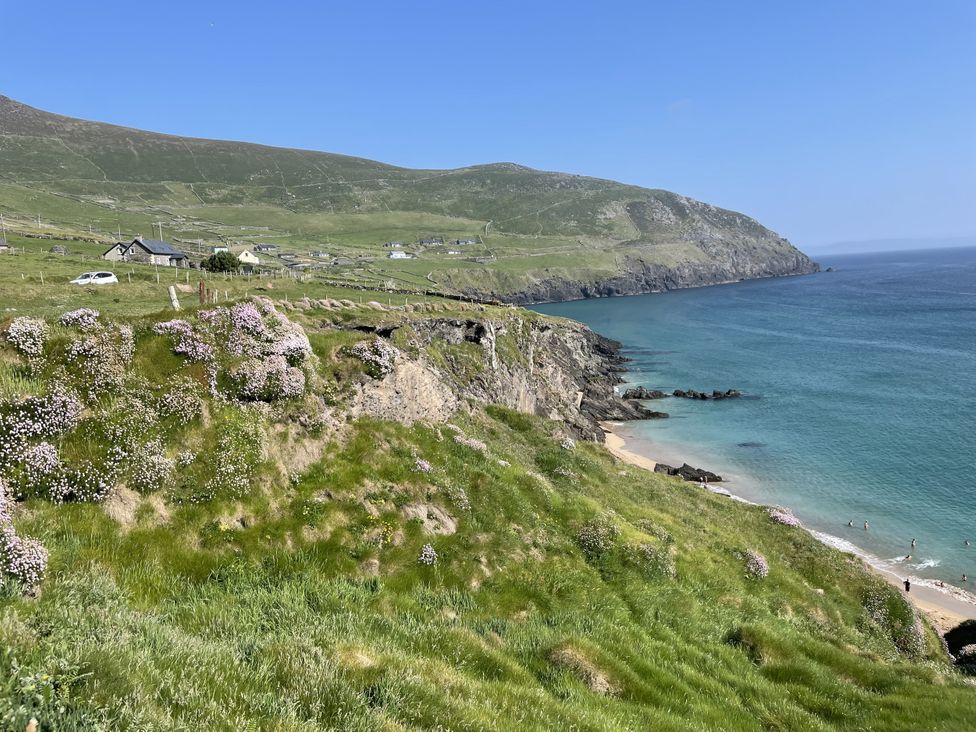 A coastal view with houses and beach at The Faithfuls Cabin in Dingle, County Kerry