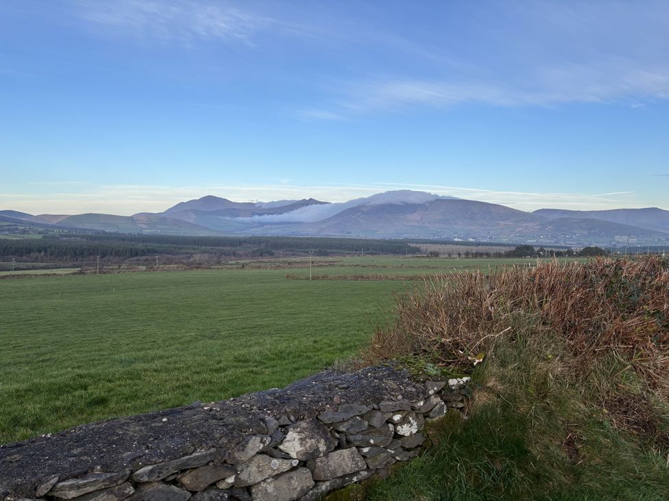 A view of mountains and fields at The Faithfuls Cabin in Dingle, County Kerry