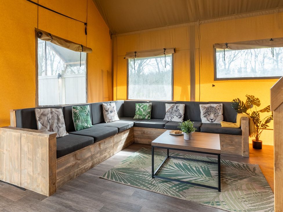 A living room with a sofa and coffee table at Kruger (Pet) in Penrith