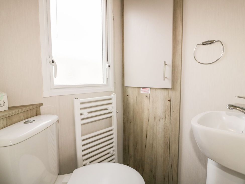 A bathroom with a toilet and sink at Barney's Retreat in Newquay