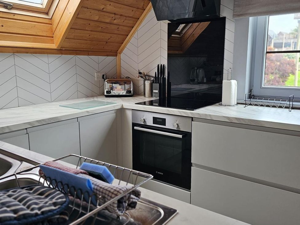 A kitchen with a sink and cabinets at Kinder Lodge 3 Portreath