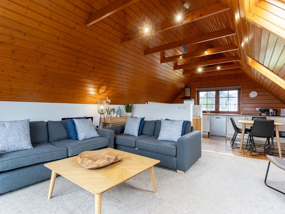 A living room with a sofa and coffee table at Kinder Lodge 3 Spa (Pet), Redruth