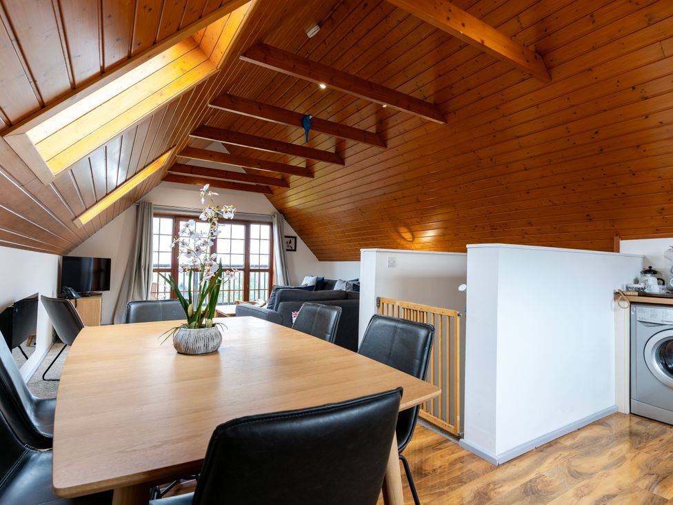 A living room with a table and chairs at Kinder Lodge 3 Spa (Pet) Redruth