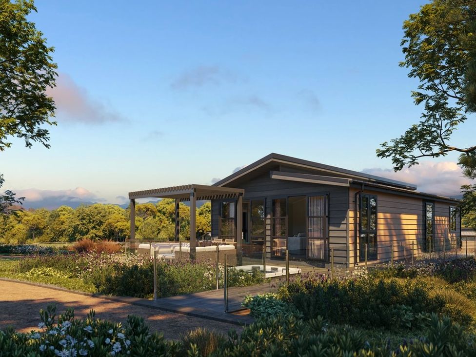 A house with a deck and pergola in the garden at Hesk (Pet) in Penrith
