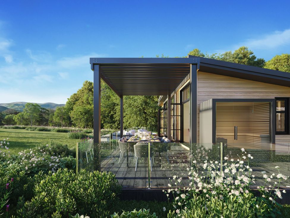A house with a deck and outdoor seating at Souther (Pet) Penrith