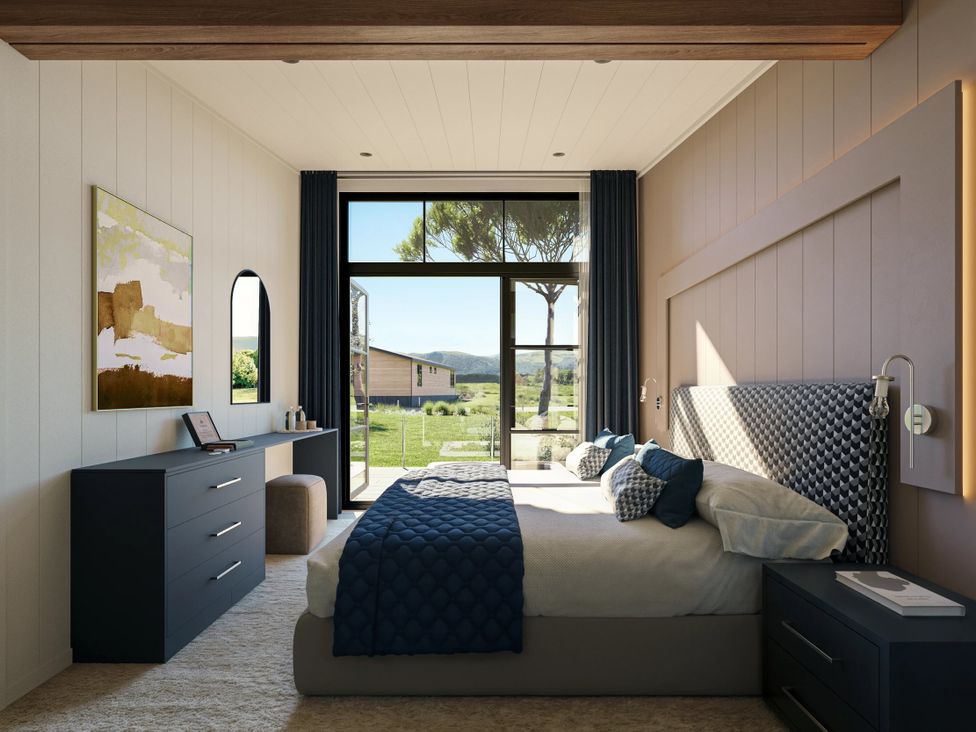 A bedroom with a bed and dresser at Souther (Pet) in Penrith