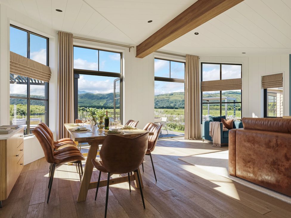 A dining room with a table and chairs at Wansfell (Pet) in Penrith