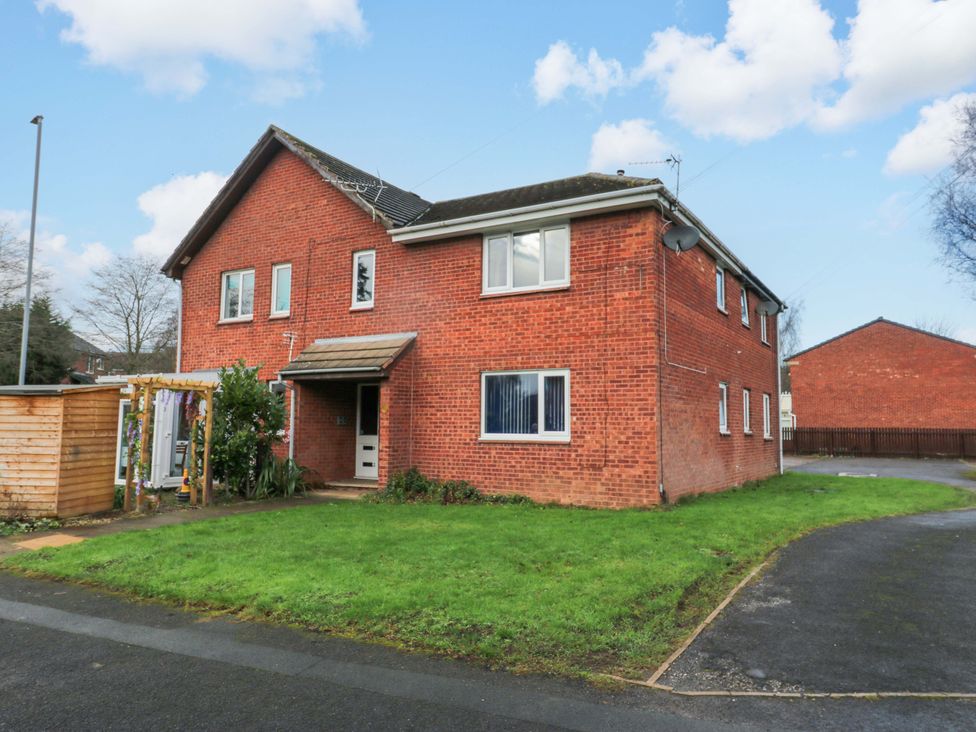 A house with a pathway and grass at Cosy Nook in Leeds
