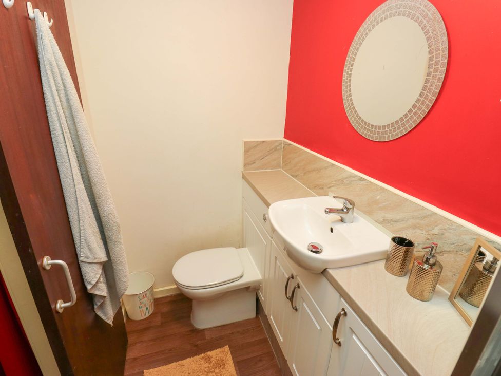 A bathroom with a sink and toilet at Cosy Nook in Leeds