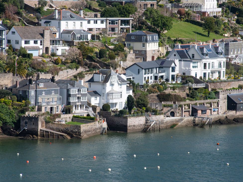 A row of houses beside the water at Tides Door in Dartmouth
