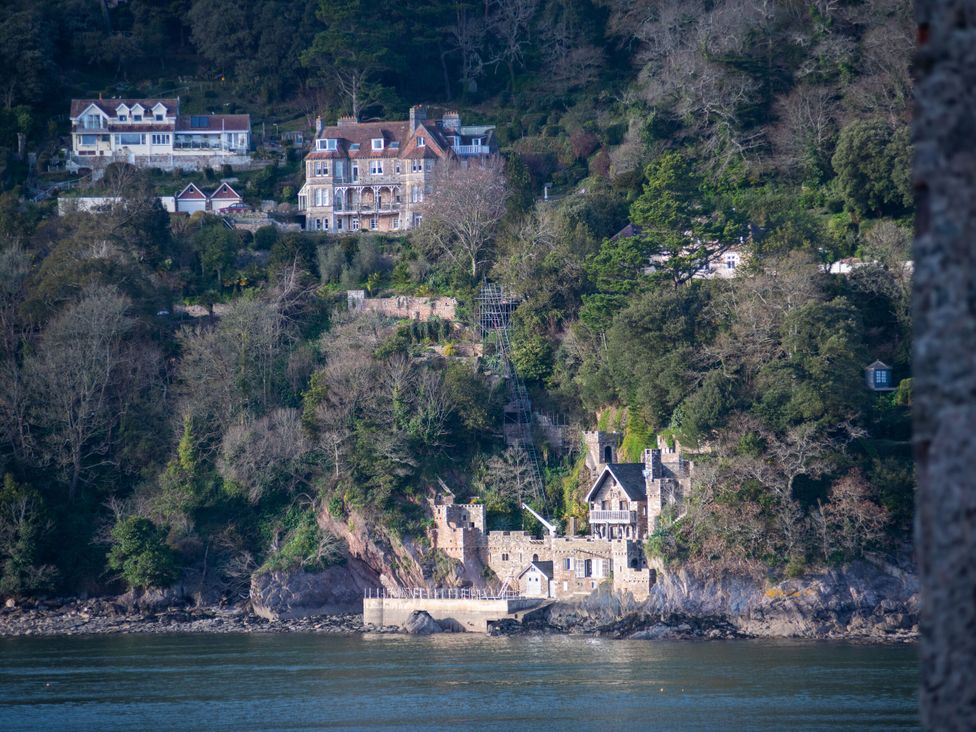 A view of houses on a hill by the water at Tides Door in Dartmouth