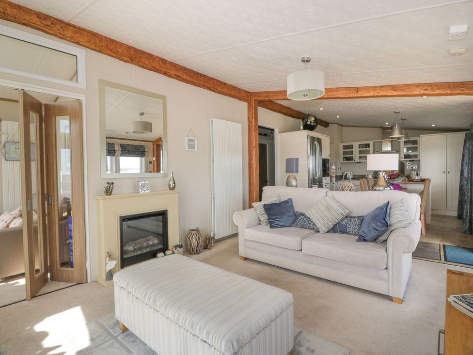 A living room with a sofa and coffee table at 1, Fisherman’s hill