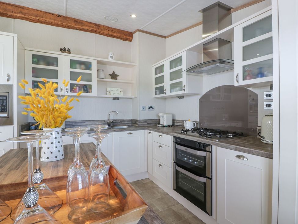 A kitchen with cabinets and appliances at 1, Fisherman’s hill