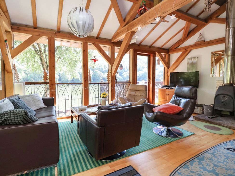 A living room with a sofa and armchairs at The Boat House Rudyard Lake