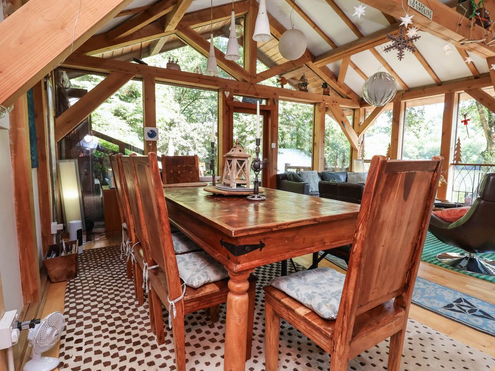 A dining room with a table and chairs at The Boat House in Rudyard Lake
