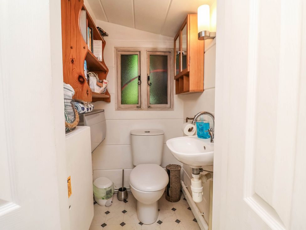 A bathroom with a toilet and sink at The Boat House Rudyard Lake