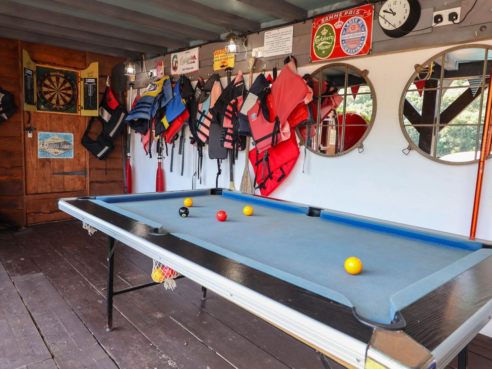 A game room with a pool table and dartboard at The Boat House Rudyard Lake