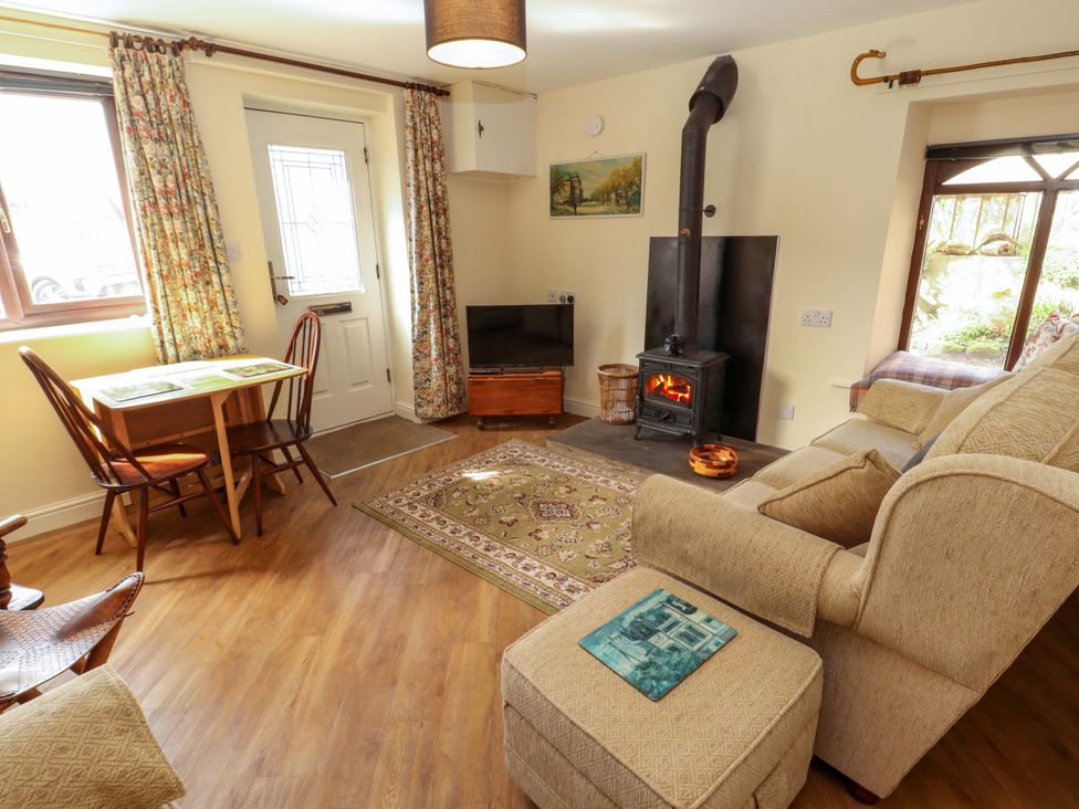 A living room with a sofa and coffee table at The Barn in Warcop