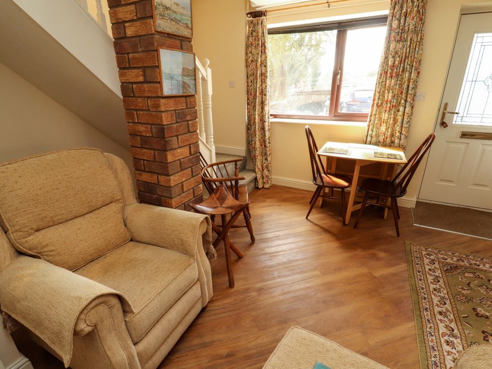 A living room with a sofa and table at The Barn in Warcop