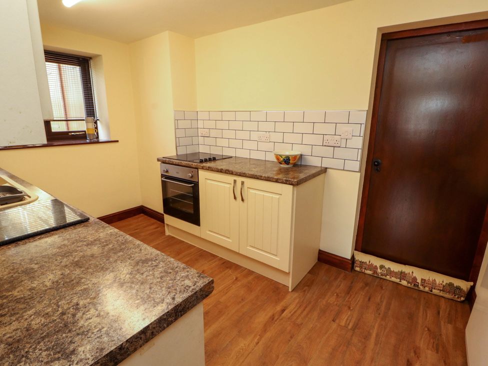 A kitchen with an oven and countertop at The Barn in Warcop