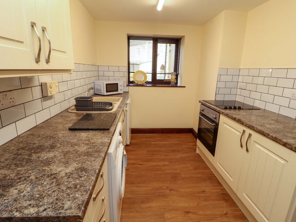 A kitchen with a sink and oven at The Barn in Warcop