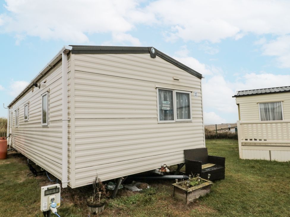 A caravan and a small outdoor area at 37 Redcar