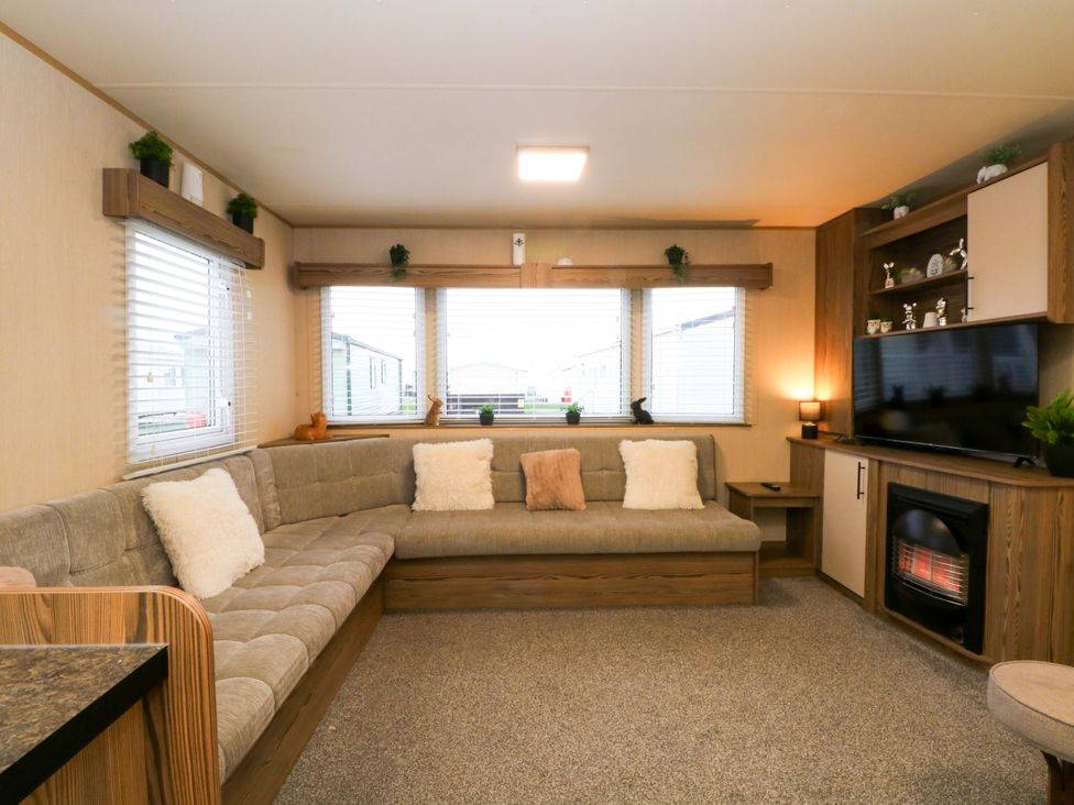 A living room with a couch and television at F2 