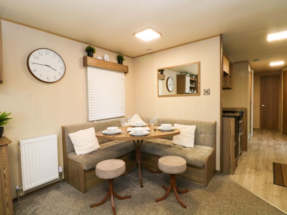 A dining area with a table and seating at F2