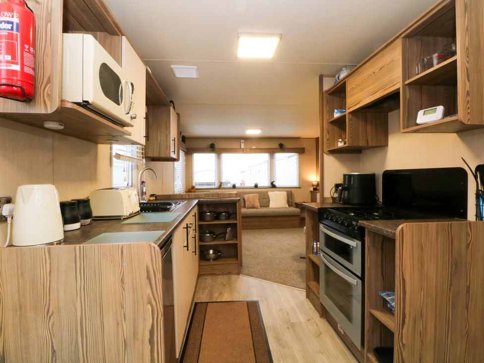 A kitchen with appliances and furniture at F2 