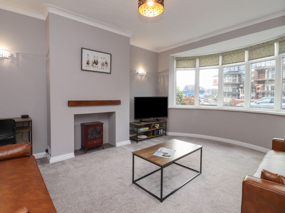 A living room with a sofa and coffee table at Flat 6 in Lytham St. Annes