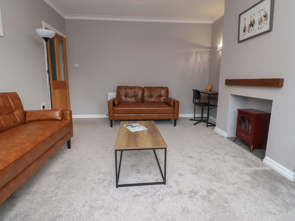 A living room with sofas and a coffee table at Flat 6 in Lytham St. Annes