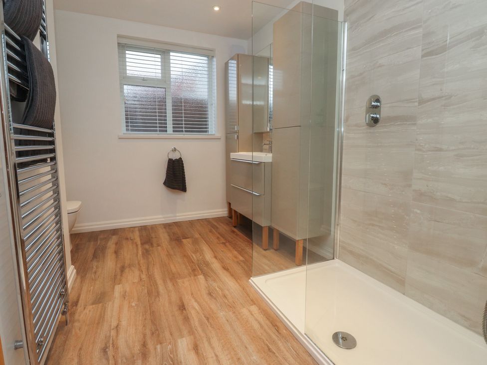 A bathroom with a shower and sink at Flat 6 in Lytham St. Annes