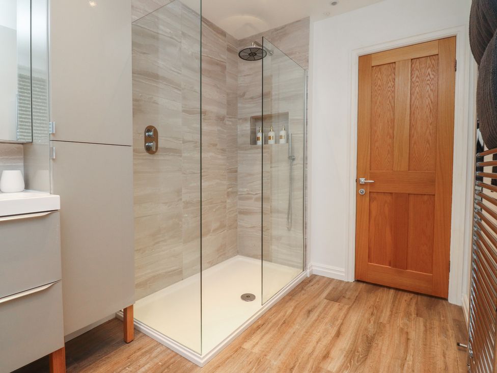 A bathroom with a shower and sink at Flat 6 in Lytham St. Annes