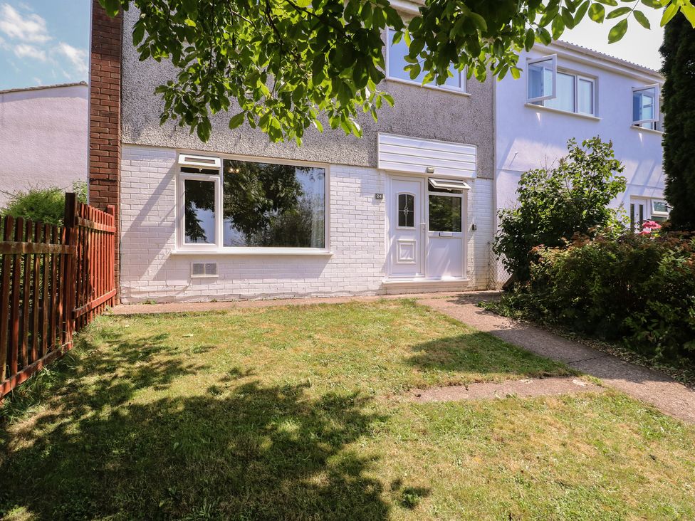 A house with a garden and pathway at 24 Cefn Court Newport