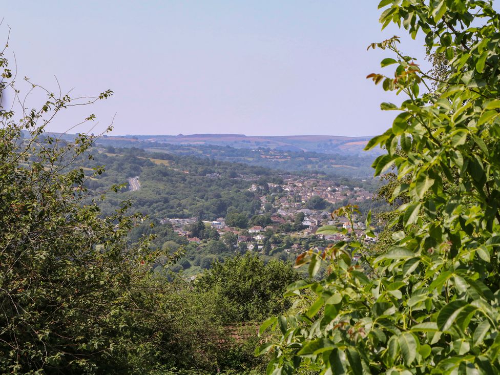 A landscape view with hills and houses at 24 Cefn Court Newport